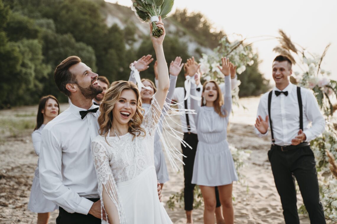people celebrating wedding beach