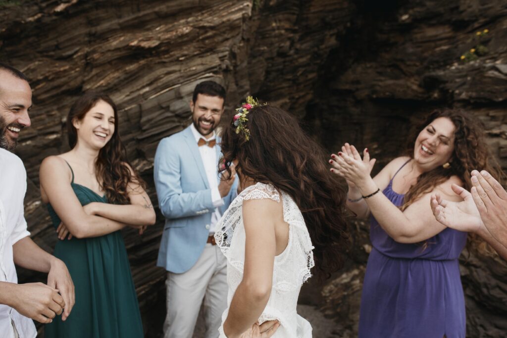 Beautiful young couple having their wedding on the beach