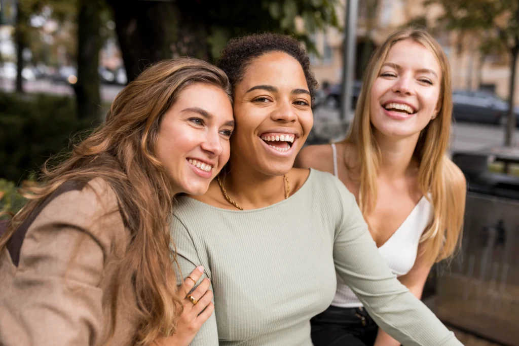 laughing women taking selfie scaled