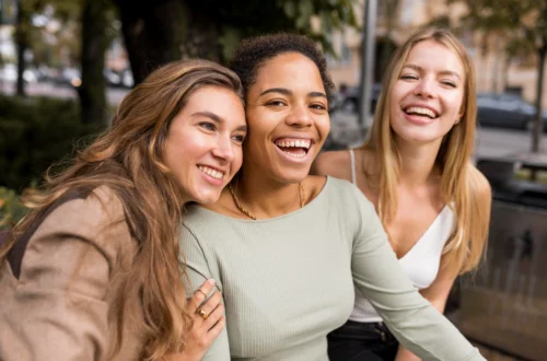 laughing women taking selfie scaled